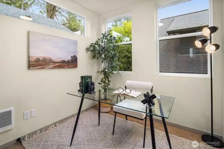 Dedicated office space filled with natural light, perfect for a quiet work-from-home environment.