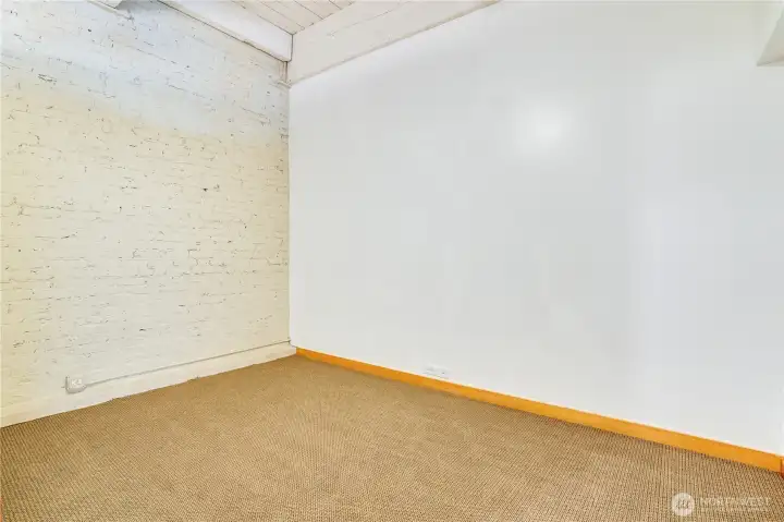 Spacious and serene, the bedroom comfortably accommodates a bed, nightstands, dressers, and more—room to truly relax and unwind.