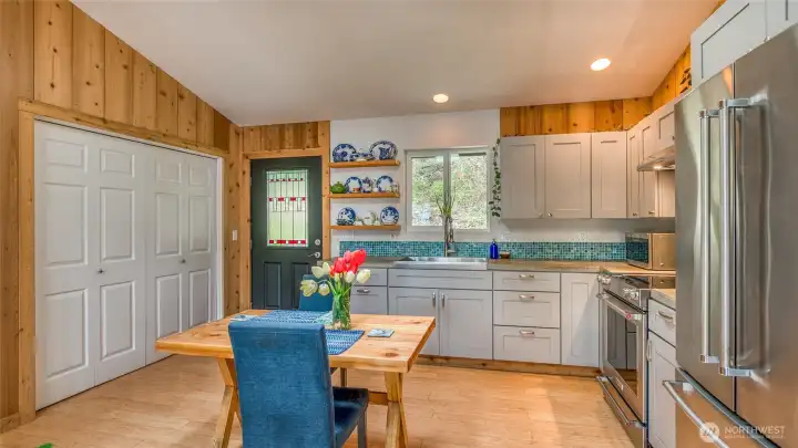 The closet doors on the left conceal the new washer and dryer plus a water heater.