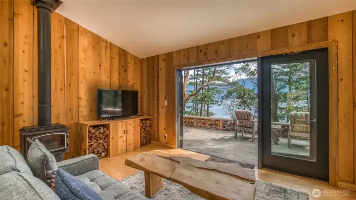 The new wide plank cedar walls add a modern rustic feel. Opening the double doors really brings the outside in. The Regency woodstove is scheduled for inspection mid-May. This small home can be heated efficiently and cost-effectively by woodstove, but there are also 5 convection heaters for zone heating. Three of the 5 convection heaters have been replaced.