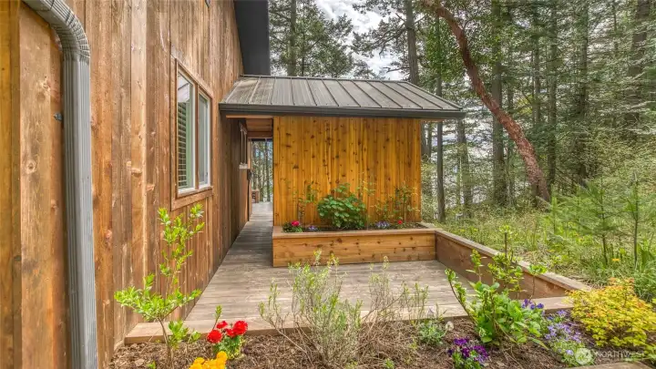 Beyond the bathhouse is a new sunddeck with built-in planters
