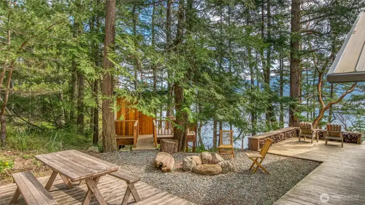 Cedar decking, firepit area and bridge to mini treehouse studio