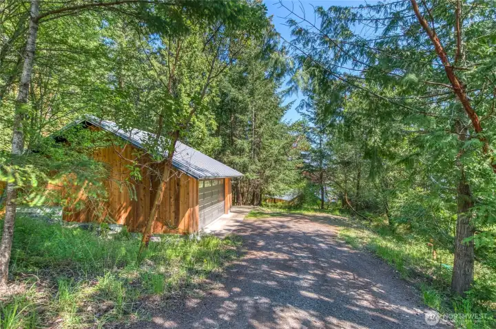 Entering the driveway, the garage is on the left and you can see the house in the distance
