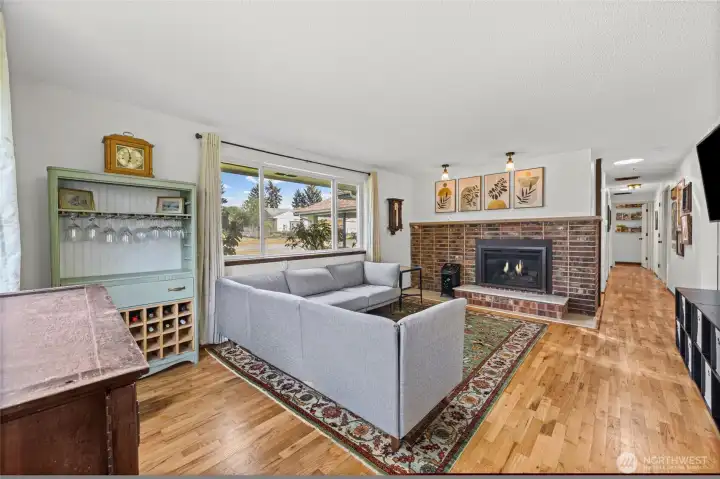 Another view of the spacious living area.  The hallway on the right goes to a primary bedroom with en-suite and two additional bedrooms.