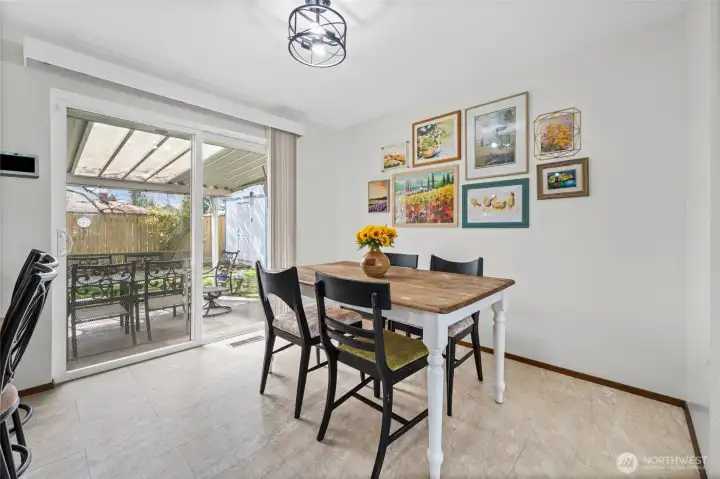 Spacious dining area has room for a larger table.  Additional seating available outside under the covered patio.