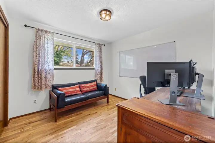 The 2nd bedroom with wall-to-wall closet.  The window looks out to the front yard.