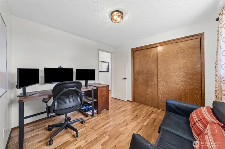 The wood flooring continues to bedroom 2.