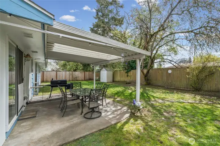 The backyard covered patio is the perfect spot for grilling, outdoor entertaining or just relaxing.  Backyard is fully fenced.