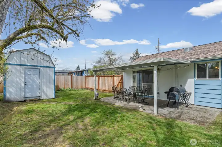 Large storage shed stays with the property.