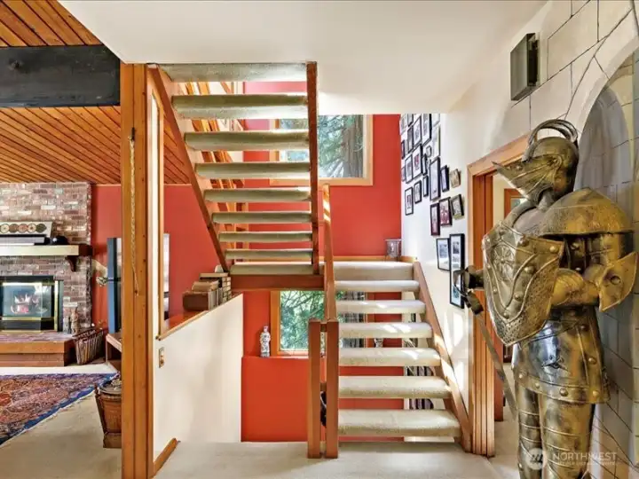 Stairwell going up to the entire top floor primary suite.
