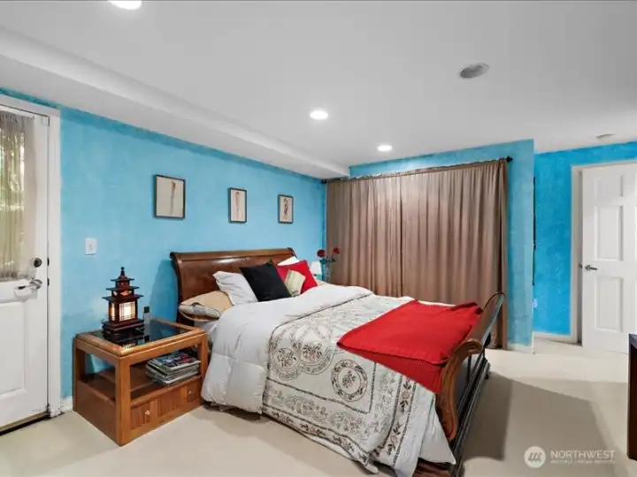 Downstairs bedroom door opens to backyard.