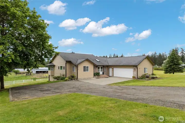 A luxury Kitsap County home set on private acreage, surrounded by sweeping lawns, mature trees, and peaceful Pacific Northwest views. With refined privacy, generous space, and equestrian amenities, this estate offers an elevated lifestyle in Port Orchard.