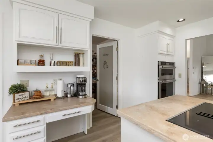Elegant kitchen details include a walk-in pantry and refined coffee station, blending beautiful design, smart storage, and everyday luxury.