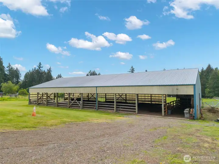 Impressive 60' x 120' covered arena with lighting, offering year-round riding, training, and equestrian versatility with generous space and functional open-air design.