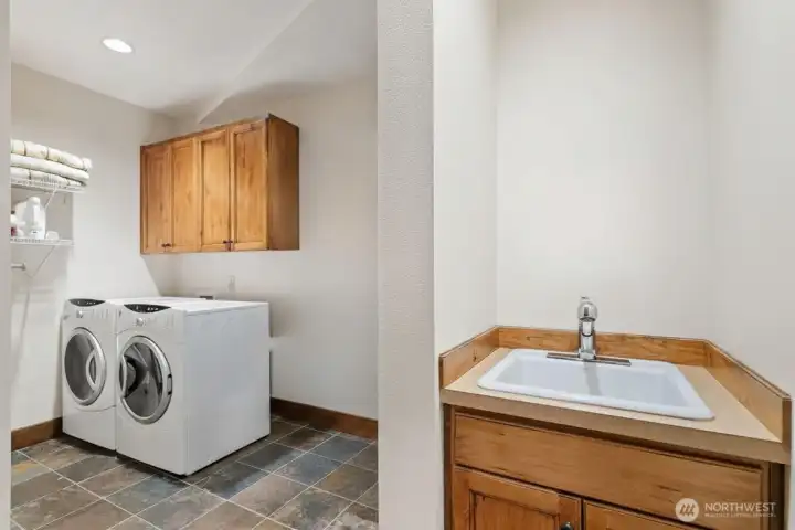Laundry room with potential for 1/2 bath (buyer to verify)