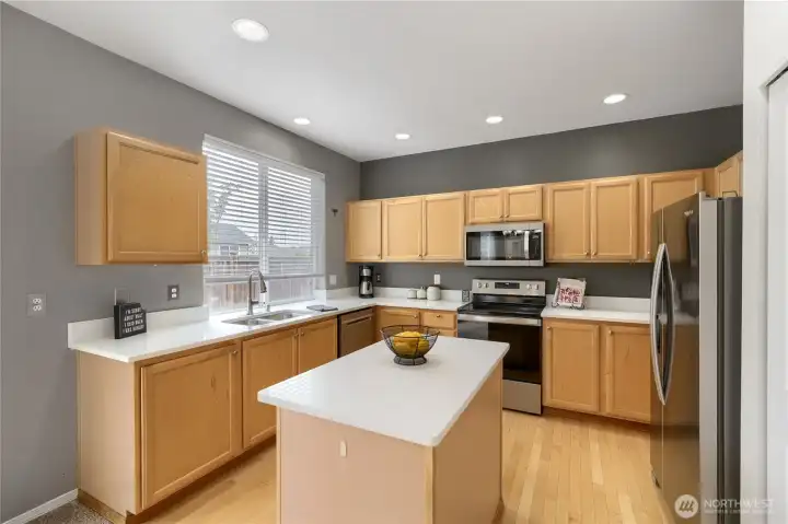 Updated kitchen with quartz countertops & stainless steel appliances