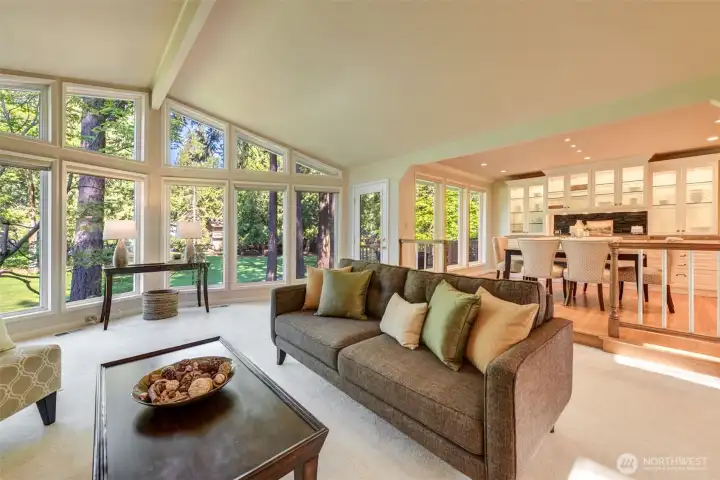 Vaulted ceilings and an open layout create an effortless connection between the living room and adjoining dining area.