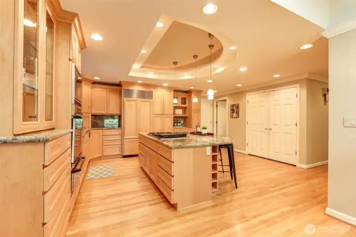 A functional open-concept layout nearby garage entry, powder bath, and the dedicated laundry space.