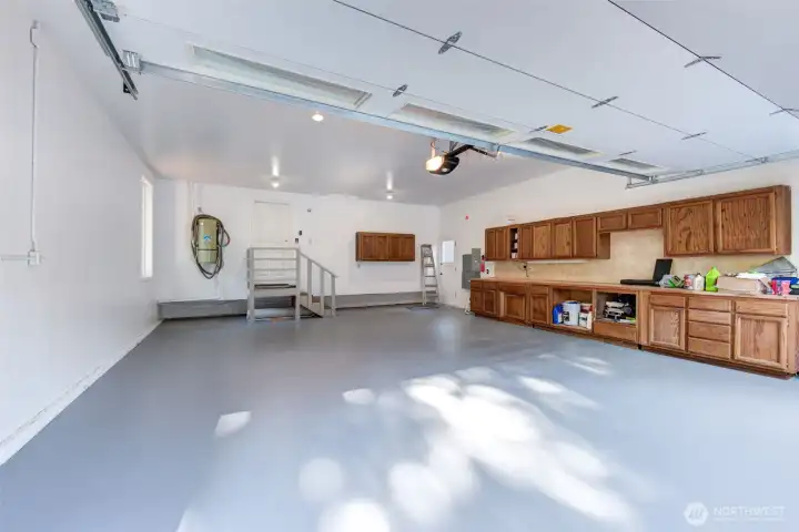 Two car garage with built-in storage, workshop space, and room for hobbies, projects, and more.