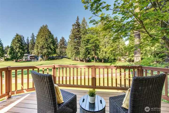 Private primary suite deck overlooking the golf course. This is the perfect spot for morning coffee or unwinding at the end of the day.