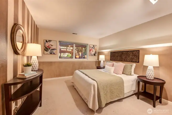 Additional lower-level bedroom offering flexibility for guests, hobbies, or multigenerational living. Large closet not pictured.