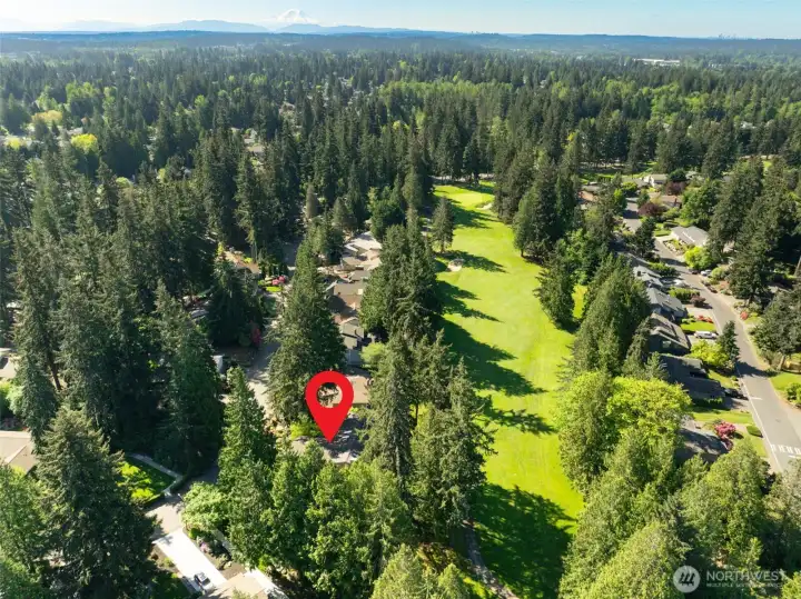 Aerial view of the home, nestled on the Mill Creek golf course.