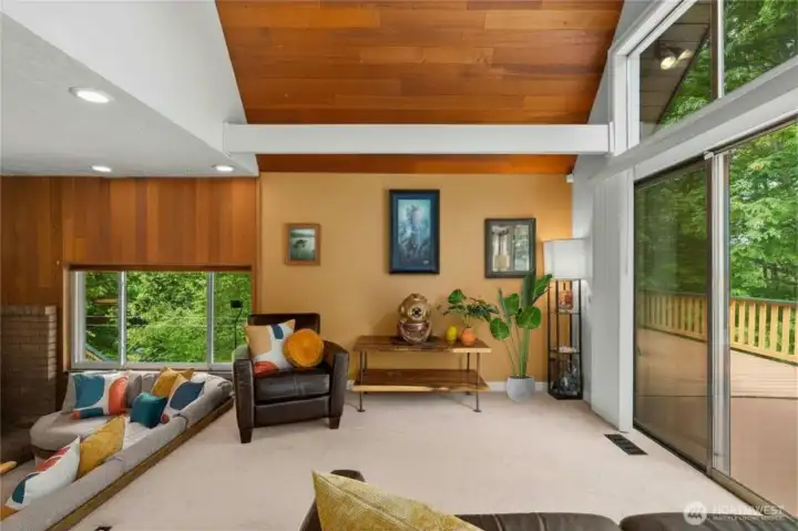 And just through the sliding doors is your huge wrap-around deck.  Perfect for enjoying the peaceful sounds of birds in the forest space around back.