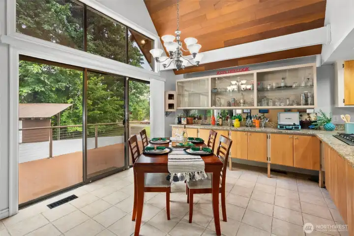Loads of storage and display space in these glass-front cabinets and lowers. And dine with a deck view.