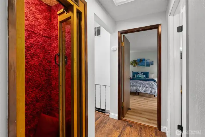 why yes, that is a vintage phone booth, with wooded doors and just a touch of shag carpet for the 70s era style