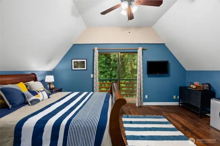 Upstairs primary, with balcony for a peaceful view and breeze