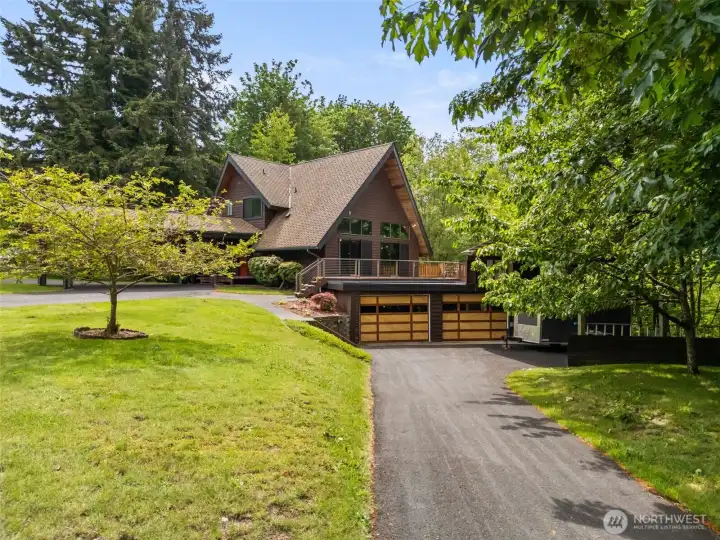 Huge double lot with fruit-bearing cherry trees is the perfect setting for this architectural beauty. It's the only one like it... and it could be yours.