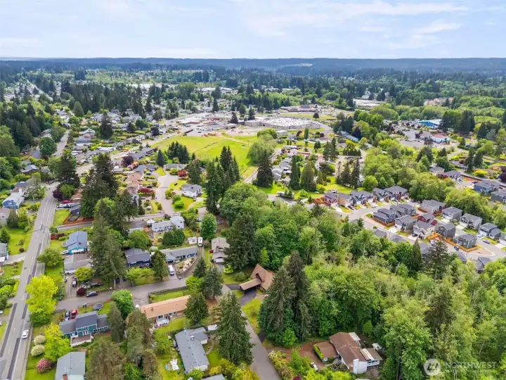 Lush greenspace gives a serenity to your stand-out custom home, and just a minute from SK Senior High.