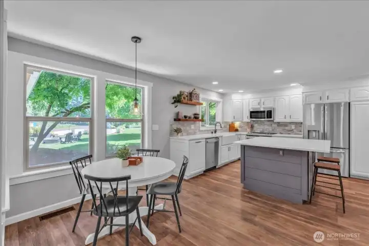 The eat-in kitchen has a comfortable breakfast nook.