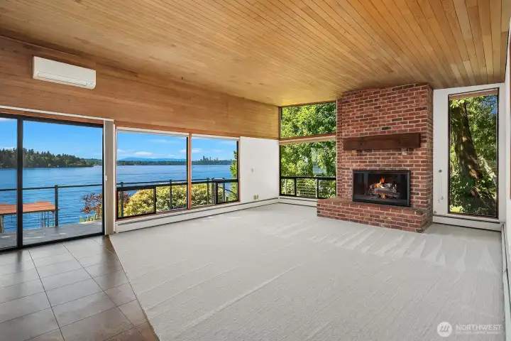 Walls of windows and clear cedar tongue and groove ceilings.