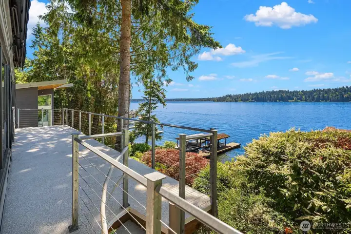 A spiral staircase leads you down to the lower level and waterfront