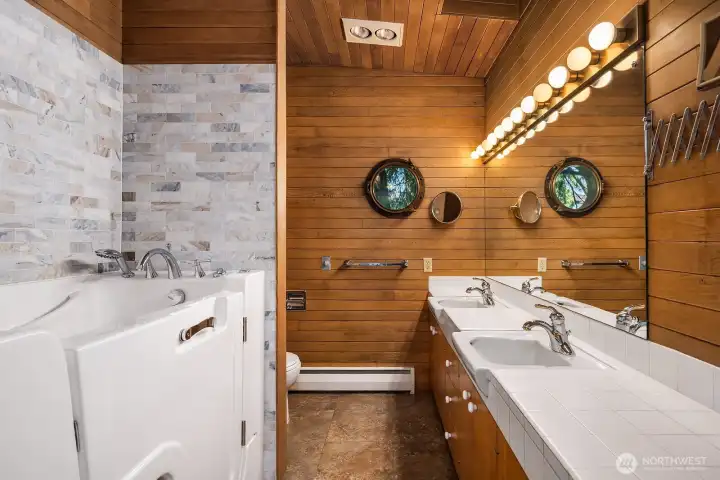 Full bathroom with a walk-in tub on the main level.