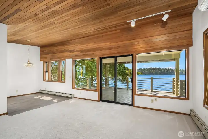 Spacious living area with gas fireplace and dining nook.