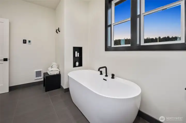 Big soaking tub, heated flooring, floating vanity.