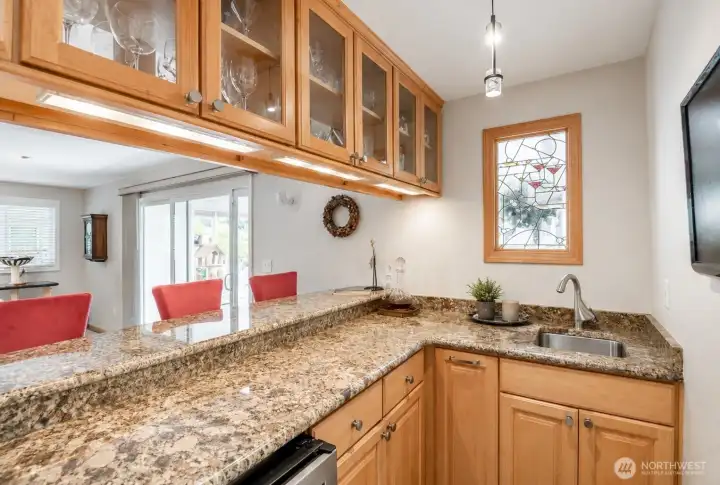 An entertainer's dream, the custom wet bar-perfect for hosting family and friends.