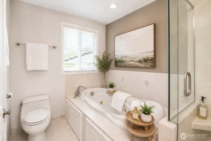 Spacious primary bath offers a rejuvenating jetted tub for a true spa-like experience.