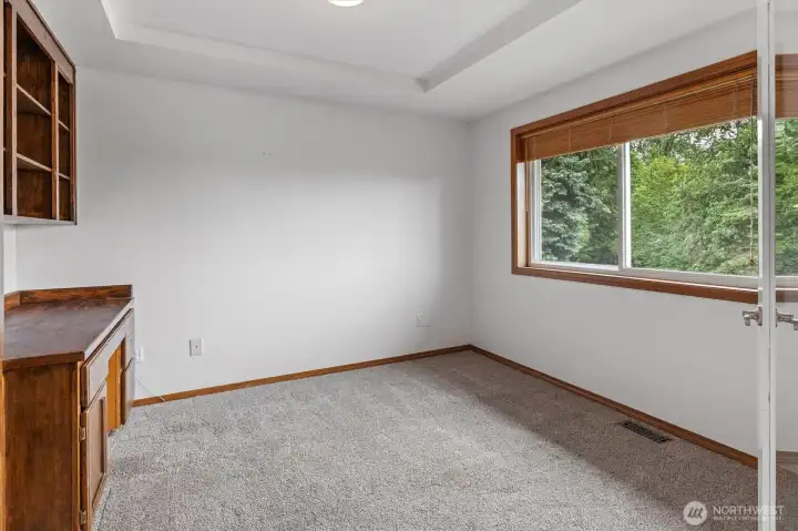 Office on main with rich built in cabinetry