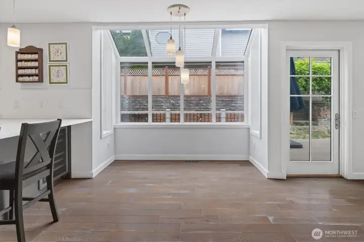 Kitchen bar and breakfast nook. Don't miss the built in wine cooler!