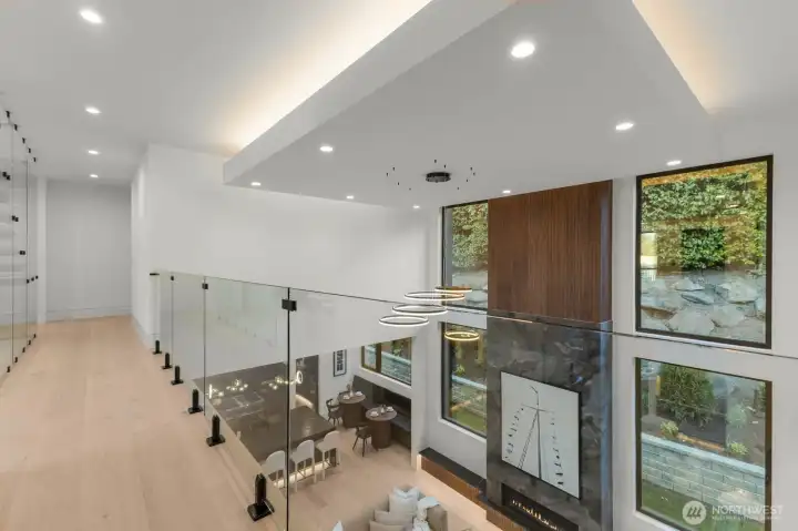 Overlook the Foyer and the Main Living room from the 2nd floor with Glass panel railings. Overlook the Foyer and the Main Living room from the 2nd floor with Glass panel railings.