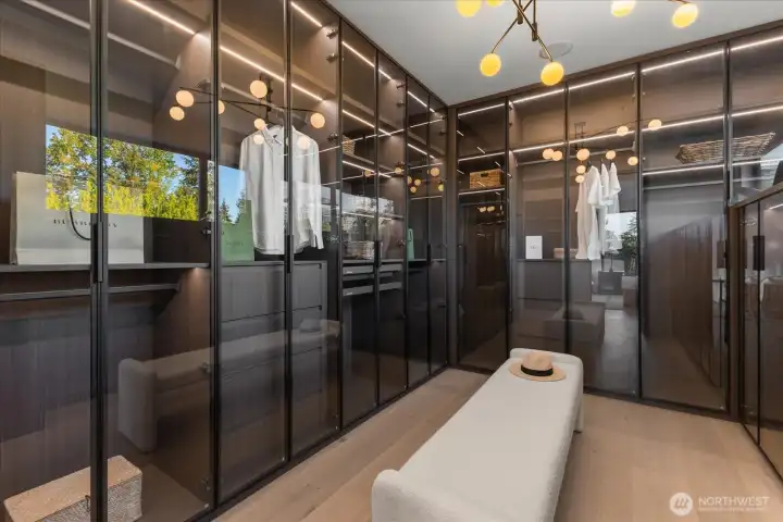 Custom walk in closet with motion sensor lighting. Custom walk in closet with motion sensor lighting.