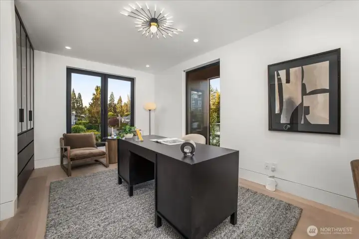 Office with built in cabinets and motion sensor lighting , with views of the skyline Office with built in cabinets and motion sensor lighting , with views of the skyline