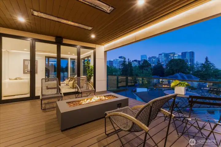 2 outdoor spaces with gas space heaters built into the ceiling and custom firepit/fireplace 2 outdoor spaces with gas space heaters built into the ceiling and custom firepit/fireplace