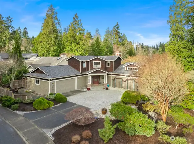 Beautiful mosiac driveway accent, 2 car garage and amazing landscaping