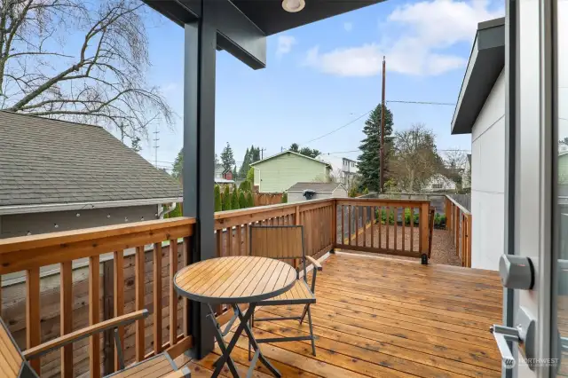 Deck in backyard. Fully fenced backyard is perfect for everyone pets included!