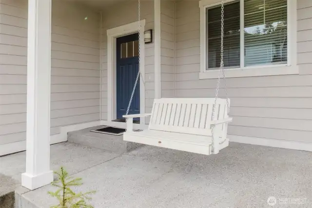 Beautiful Covered Front Porch with relaxation swing!