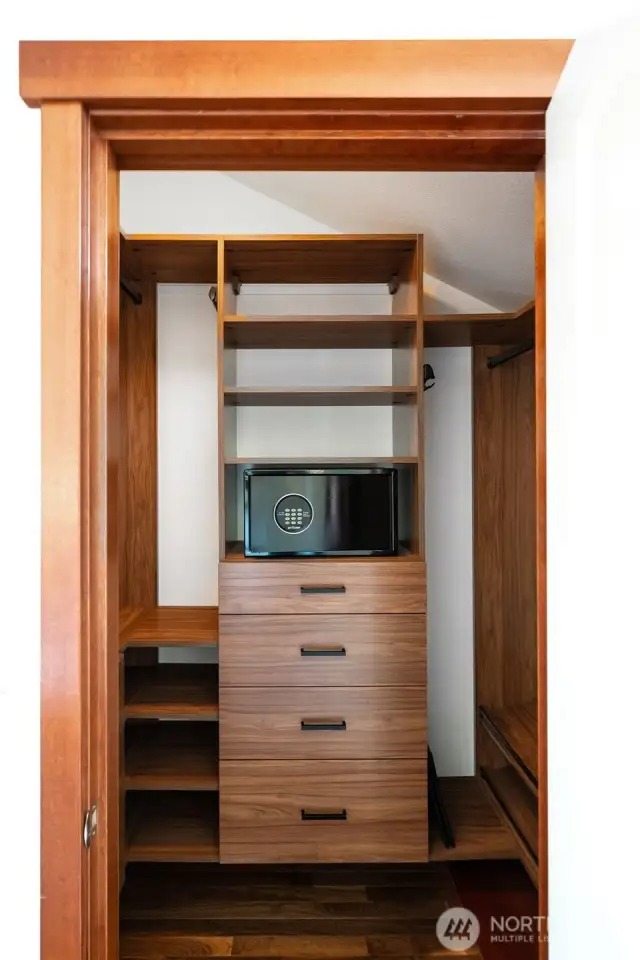 Primary bedroom closet #1 with safe and built-in shelves/drawers